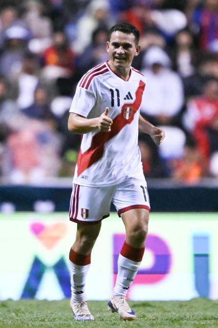 Peru's midfielder #11 Jairo Velez celebrats after scoring a goal during the international friendly football match between Peru and Spain at Cuauhtemoc Stadium in Puebla, Mexico, on June 8, 2026. (Photo by CARL DE SOUZA / AFP)