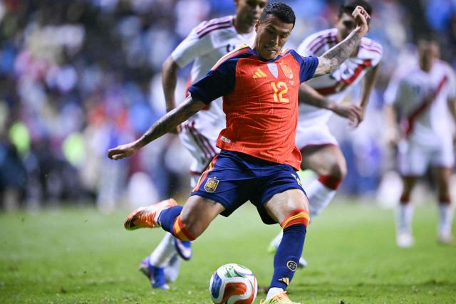 Spain's defender #12 Pedro Porro shoots the ball during the international friendly football match between Peru and Spain at Cuauhtemoc Stadium in Puebla, Mexico, on June 8, 2026. (Photo by CARL DE SOUZA / AFP)