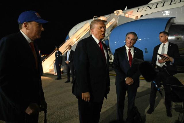 US President Donald Trump speaks to the press before boarding Air Force One prior to departure from John F. Kennedy International Airport, in New York, on June 8, 2026. Trump is returning to the White House after attending Game Three of the NBA Finals. (Photo by SAUL LOEB / AFP)