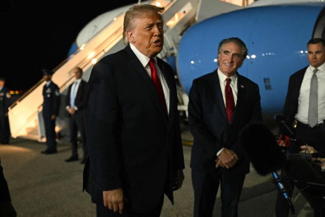 US President Donald Trump speaks to the press before boarding Air Force One prior to departure from John F. Kennedy International Airport, in New York, on June 8, 2026. Trump is returning to the White House after attending Game Three of the NBA Finals. (Photo by SAUL LOEB / AFP)