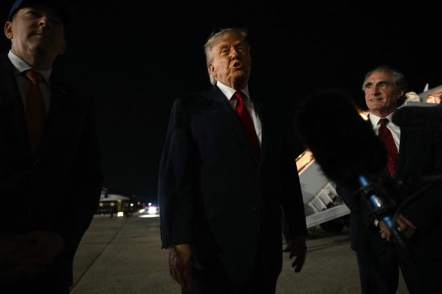 US President Donald Trump speaks to the press before boarding Air Force One prior to departure from John F. Kennedy International Airport, in New York, on June 8, 2026. Trump is returning to the White House after attending Game Three of the NBA Finals. (Photo by SAUL LOEB / AFP)