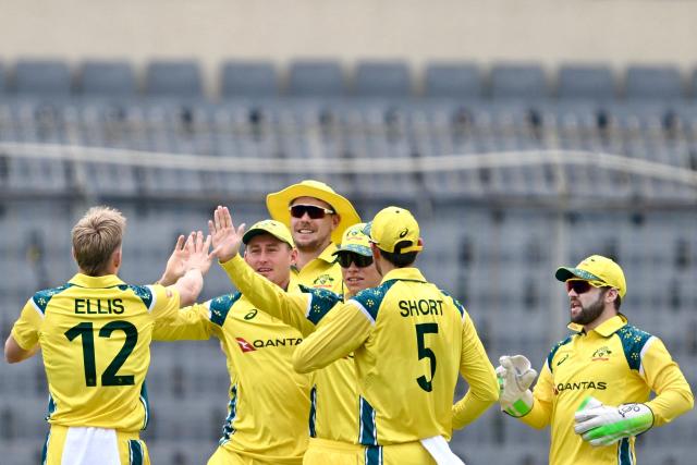 Australia's Nathan Ellis (L) celebrates with teammates after taking the wicket of Bangladesh's Saif Hassan during the first one-day international (ODI) cricket match between Bangladesh and Australia at the Sher-e-Bangla National Cricket Stadium in Dhaka on June 9, 2026. (Photo by MUNIR UZ ZAMAN / AFP)