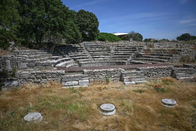 This photograph shows a view of the ancient theatre in the ruins of the ancient city of Troy in Çanakkale on June 2, 2026. A gift from the film set of "Troy", the giant Trojan Horse replica looms over the port of Canakkale on the Dardanelles Strait in western Turkey. First related by Homer, then retold for the silver screen in 2004, with Brad Pitt as Achilles, the legend of the ancient city travels to Rome's Colosseum this week, where a major new exhibition opens on June 12, 2026. (Photo by Ozan KOSE / AFP)