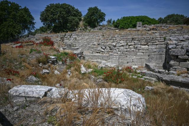 This photograph shows a view of the ruins of the ancient city of Troy in Çanakkale on June 2, 2026. A gift from the film set of "Troy", the giant Trojan Horse replica looms over the port of Canakkale on the Dardanelles Strait in western Turkey. First related by Homer, then retold for the silver screen in 2004, with Brad Pitt as Achilles, the legend of the ancient city travels to Rome's Colosseum this week, where a major new exhibition opens on June 12, 2026. (Photo by Ozan KOSE / AFP)