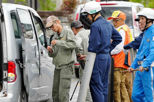 Japanese zoo staff prepare a solution to tranquilize a bear as they search for the wild animal in Utsunomiya, north of Tokyo, on June 9, 2026. A bear roaming the streets of a Japanese city for days forced the closure of nearly 100 schools, as dozens of hunters and officials searched for the animal. (Photo by Yuichi YAMAZAKI / AFP)
