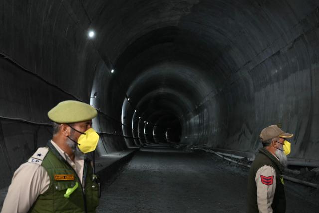 Indian police personnel stand guard at the Zojila tunnel, India's longest road tunnel project connecting Jammu and Kashmir state with the Ladakh region on June 9, 2026. (Photo by TAUSEEF MUSTAFA / AFP)