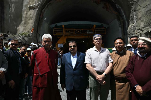 Nitin Gadkari (C), Minister of Road Transport and Highways of India and Omar Abdullah (Centre R), Chief Minister of Jammu and Kashmir pose in front of the Zojila tunnel, India's longest road tunnel project connecting Jammu and Kashmir state with the Ladakh region on June 9, 2026. (Photo by TAUSEEF MUSTAFA / AFP)