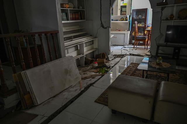 This photo shows a damaged house after a 7.8 magnitude earthquake in General Santos City on June 9, 2026. A 7.8-magnitude earthquake in the southern Philippines on June 8 killed at least 35 people, according to provincial authorities, after toppling buildings and sparking tsunami warnings across the region. (Photo by Jam STA ROSA / AFP)