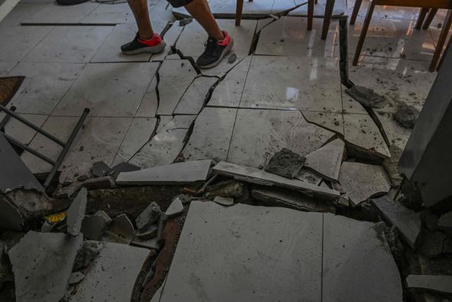 This photo shows a damaged house after a 7.8 magnitude earthquake in General Santos City on June 9, 2026. A 7.8-magnitude earthquake in the southern Philippines on June 8 killed at least 35 people, according to provincial authorities, after toppling buildings and sparking tsunami warnings across the region. (Photo by Jam STA ROSA / AFP)