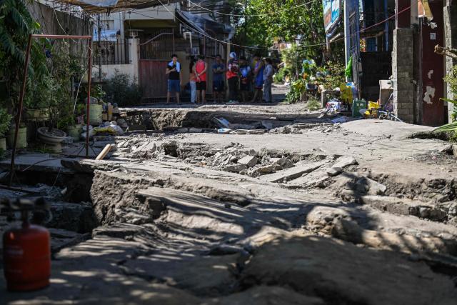 This photo shows a damaged road after a 7.8 magnitude earthquake in General Santos City on June 9, 2026. A 7.8-magnitude earthquake in the southern Philippines on June 8 killed at least 35 people, according to provincial authorities, after toppling buildings and sparking tsunami warnings across the region. (Photo by Jam STA ROSA / AFP)