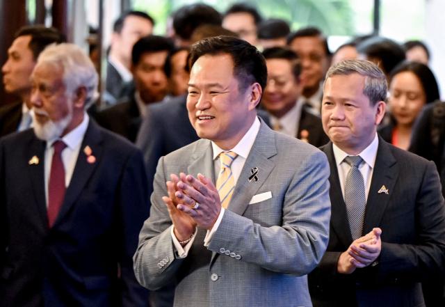 Thailand's Prime Minister Anutin Charnvirakul (C) and Cambodia's Prime Minister Hun Manet (R) arrive to attend the ASEAN Future Forum 2026 at the Melia Hotel in Hanoi on June 9, 2026. (Photo by Nhac NGUYEN / AFP)