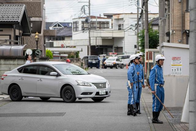 Police officers search for a wild bear in Utsunomiya, north of Tokyo, on June 9, 2026. A bear roaming the streets of a Japanese city for days forced the closure of nearly 100 schools, as dozens of hunters and officials searched for the animal. (Photo by Yuichi YAMAZAKI / AFP)