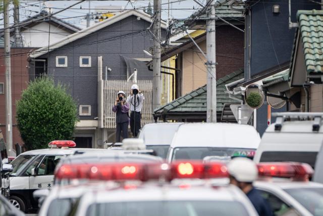 Members of the media watch as hunters and zoo staff search for a wild bear in Utsunomiya, north of Tokyo, on June 9, 2026. A bear roaming the streets of a Japanese city for days forced the closure of nearly 100 schools, as dozens of hunters and officials searched for the animal. (Photo by Yuichi YAMAZAKI / AFP)