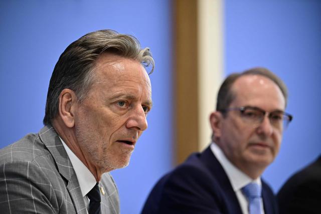 Germany's Interior Minister Alexander Dobrindt (R) and and the head of the Federal Criminal Police Office (BKA), Holger Munch attend a press conference on politically motivated crime in Berlin, on June 9, 2026. Interior Minister Alexander Dobrindt (CSU) and the head of the Federal Criminal Police Office (BKA), Holger Münch presented the annual report on the development of politically motivated crime in Germany. (Photo by Tobias SCHWARZ / AFP)