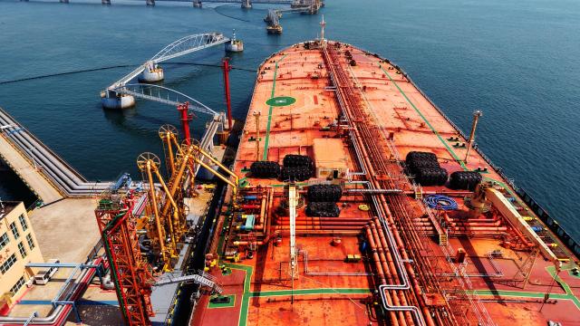 This aerial photo shows a tanker unloading imported crude oil at a terminal port in Qingdao, in China’s eastern Shandong province on June 9, 2026. (Photo by CN-STR / AFP) / China OUT