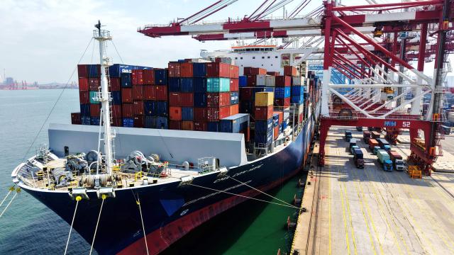 A container ship is berthed at the container terminal of Qingdao port, in China’s eastern Shandong province on June 9, 2026. (Photo by CN-STR / AFP) / China OUT