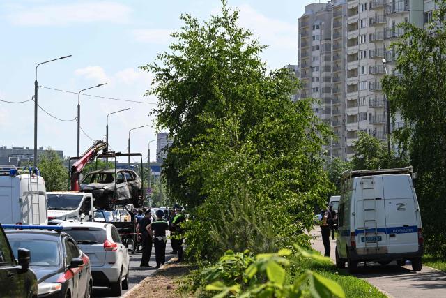 The wreckage of a car is loaded onto the platform of a truck after a blast caused by an explosive device killed its driver in Balashikha, outside Moscow, on June 9, 2026. (Photo by Igor IVANKO / AFP)