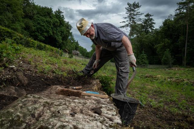 An archaeologist works at the excavation site of the Gallo-Roman sanctuary dedicated to Sequana, the goddess of the river in Source Seine on May 8, 2026. After 60 years of neglect, excavations have resumed at the source of the Seine in Burgundy, at the Gallo-Roman sanctuary dedicated to Sequana, the goddess of the river. (Photo by ARNAUD FINISTRE / AFP)