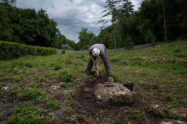 An archaeologist works at the excavation site of the Gallo-Roman sanctuary dedicated to Sequana, the goddess of the river in Source Seine on May 8, 2026. After 60 years of neglect, excavations have resumed at the source of the Seine in Burgundy, at the Gallo-Roman sanctuary dedicated to Sequana, the goddess of the river. (Photo by ARNAUD FINISTRE / AFP)
