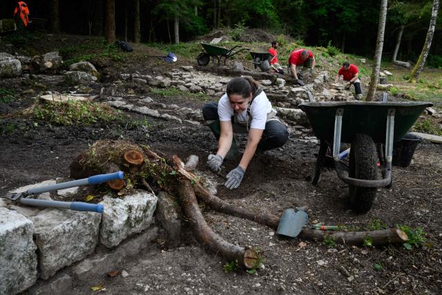 Archaeologists work at the excavation site of the Gallo-Roman sanctuary dedicated to Sequana, the goddess of the river in Source Seine on May 8, 2026. After 60 years of neglect, excavations have resumed at the source of the Seine in Burgundy, at the Gallo-Roman sanctuary dedicated to Sequana, the goddess of the river. (Photo by ARNAUD FINISTRE / AFP)