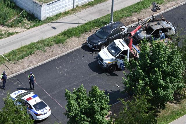 Law enforcement officers work at the site of a car bomb, which killed a driver, in Balashikha, outside Moscow, on June 9, 2026. (Photo by Igor IVANKO / AFP)