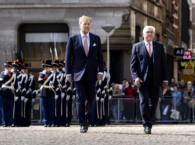 Netherlands' King Willem-Alexander (L) and German President Frank-Walter Steinmeier review troops as they arrive at Dam Square in Amsterdam on June 9, 2026. German President Frank-Walter Steinmeier is paying a three-day state visit to the Netherlands. (Photo by Remko de Waal / ANP / AFP) / Netherlands OUT