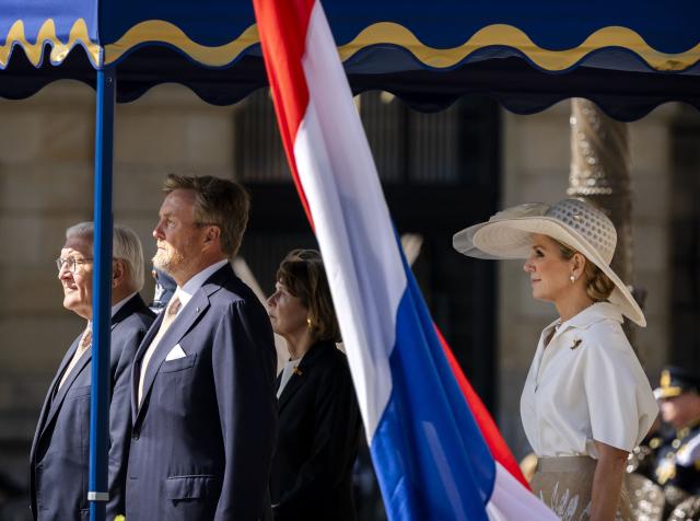 Netherlands' King Willem-Alexander (C) and Netherlands' Queen Maxima (R) welcome German President Frank-Walter Steinmeier (L) at Dam Square in Amsterdam on June 9, 2026. German President Frank-Walter Steinmeier is paying a three-day state visit to the Netherlands. (Photo by Remko de Waal / ANP / AFP) / Netherlands OUT