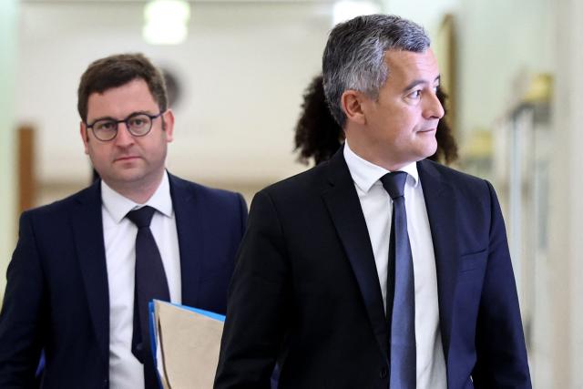 France's Justice Minister Gerald Darmanin (R) arrives alongside his parliamentary advisor Etienne Diot (L) to attend a hearing regarding the Lyhanna case before the Senate's Law Committee in Paris on June 9, 2026. The body of teenager Lyhanna was found on June 4, 2026, after she went missing on May 29 in the southwestern town of Fleurance. The accused, the father of a school friend of the victim, had twice before been formally accused of raping a child. The case sparked outrage over judicial lapses in the handling of the suspect. (Photo by SIMON WOHLFAHRT / AFP)