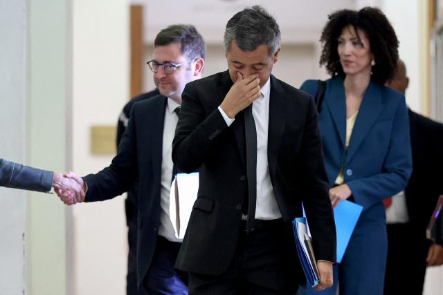 France's Justice Minister Gerald Darmanin (C) arrives alongside his justice advisor Alice Cherif (R) and parliamentary advisor Etienne Diot (L) to attend a hearing regarding the Lyhanna case before the Senate's Law Committee in Paris on June 9, 2026. The body of teenager Lyhanna was found on June 4, 2026, after she went missing on May 29 in the southwestern town of Fleurance. The accused, the father of a school friend of the victim, had twice before been formally accused of raping a child. The case sparked outrage over judicial lapses in the handling of the suspect. (Photo by SIMON WOHLFAHRT / AFP)