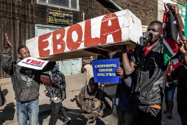 Protesters carry a mock coffin as they march during a demonstration against a controversial US-built Ebola quarantine centre slated to begin operations at Laikipia Air Base in Nanyuki on June 9, 2026. Several Kenyans were arrested on June 9, 2026 in the latest protests against an Ebola quarantine centre being built for US citizens in a tourist town.
The centre at Laikipia Air Base in the town of Nanyuki, under the shadow of Mount Kenya, is set to quarantine Americans arriving from the Democratic Republic of Congo (DRC), which is battling a major Ebola outbreak. (Photo by Luis TATO / AFP)