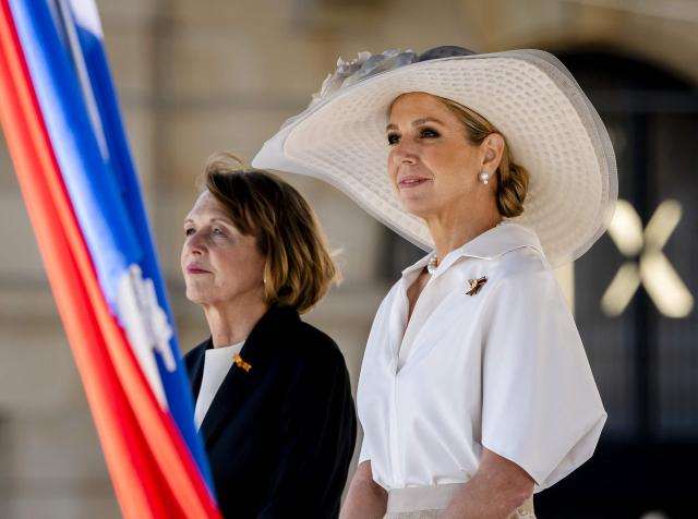 Netherlands' Queen Maxima (R) welcomes German President's wife Elke Budenbender at Dam Square in Amsterdam on June 9, 2026. German President is paying a three-day state visit to the Netherlands. (Photo by Remko de Waal / ANP / AFP) / Netherlands OUT