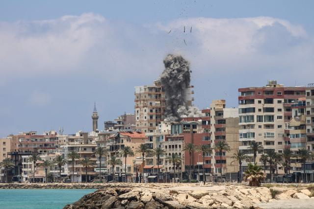 Smoke rises following an Israeli airstrike in the southern city of Tyre on June 9, 2026. Residents of south Lebanon's Tyre including the Christian quarter fled on June 9, an AFP correspondent said, after Israel's army for the first time warned the entire city to evacuate ahead of strikes. The warning came a day after Iran, which insists a halt to the wider Middle East conflict must include a ceasefire in Lebanon, warned it would resume attacks on Israel if it kept striking its neighbour. (Photo by KAWANT HAJU / AFP) / 