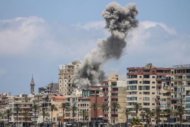 Smoke rises following an Israeli airstrike in Tyre on June 9, 2026. Residents of south Lebanon's Tyre including the Christian quarter fled on June 9, an AFP correspondent said, after Israel's army for the first time warned the entire city to evacuate ahead of strikes. The warning came a day after Iran, which insists a halt to the wider Middle East conflict must include a ceasefire in Lebanon, warned it would resume attacks on Israel if it kept striking its neighbour. (Photo by KAWANT HAJU / AFP) / 