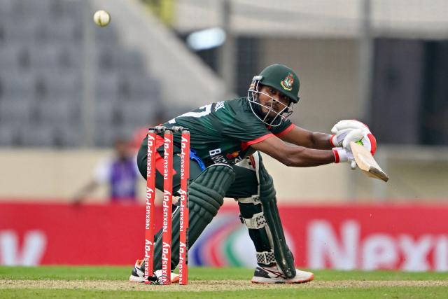 Bangladesh's Mosaddek Hossain watches the ball after playing a shot during the first one-day international (ODI) cricket match between Bangladesh and Australia at the Sher-e-Bangla National Cricket Stadium in Dhaka on June 9, 2026. (Photo by Munir UZ ZAMAN / AFP)
