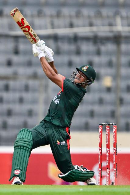 Bangladesh's Taskin Ahmed plays a shot during the first one-day international (ODI) cricket match between Bangladesh and Australia at the Sher-e-Bangla National Cricket Stadium in Dhaka on June 9, 2026. (Photo by Munir UZ ZAMAN / AFP)