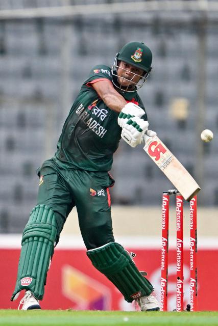 Bangladesh's Taskin Ahmed plays a shot during the first one-day international (ODI) cricket match between Bangladesh and Australia at the Sher-e-Bangla National Cricket Stadium in Dhaka on June 9, 2026. (Photo by Munir UZ ZAMAN / AFP)