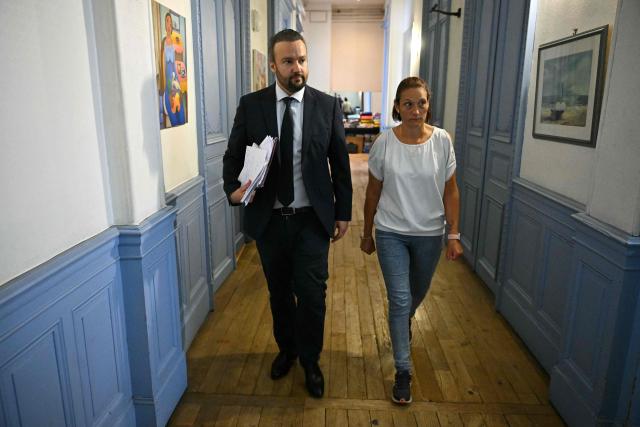 French lawyer Pierre Debuisson and Audrey (a pseudonym), the mother of a child who accused Jerome B of dozens of rapes arrive to give a press conference to announce that they are willing to file a complaint against the State and against the Minister of Justice, on June 9, 2026 in Toulouse, southwestern France. Jerome B., the prime suspect in the kidnapping and death of Lyhanna in Fleurance had been the subject of several complaints and reports of rape of minors. Some had been dismissed, but one of them, filed in August 2025, had not been followed up with a sufficiently prompt investigation. And he had neither been questioned nor taken into custody. (Photo by Lionel BONAVENTURE / AFP)