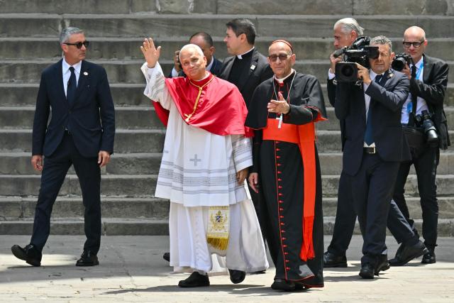 Pope Leo XIV waves as he arrives to the Cathedral of the Holy Cross and Saint Eulalia in Barcelona, on June 9, 2026. Pope Leo XIV is visiting Spain June 6-12 with stops in Madrid, Barcelona, and the Canary Islands, where he will meet with migrants and organisations dedicated to helping them. (Photo by Manu Quintero / AFP)