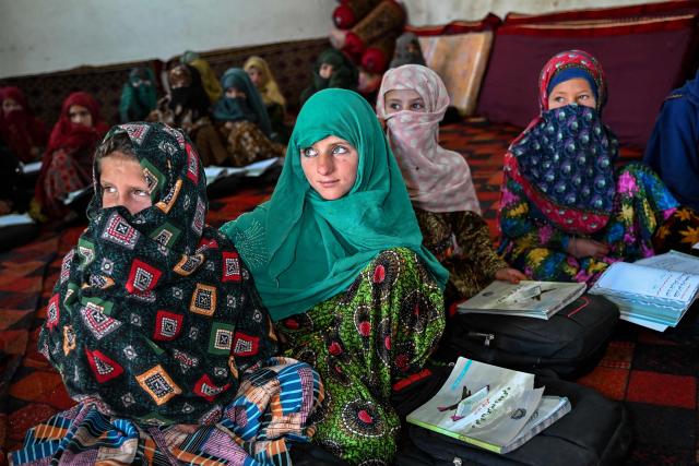 Afghan girls attend a class at a primary school in Eshtiwi village in the Parun district of Afghanistan's Nuristan province on June 8, 2026. (Photo by Wakil KOHSAR / AFP)
