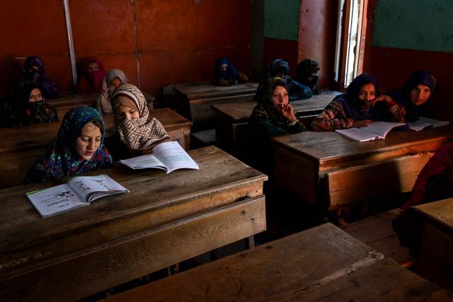 Afghan girls attend a class at a primary school in Eshtiwi village in the Parun district of Afghanistan's Nuristan province on June 8, 2026. (Photo by Wakil KOHSAR / AFP)