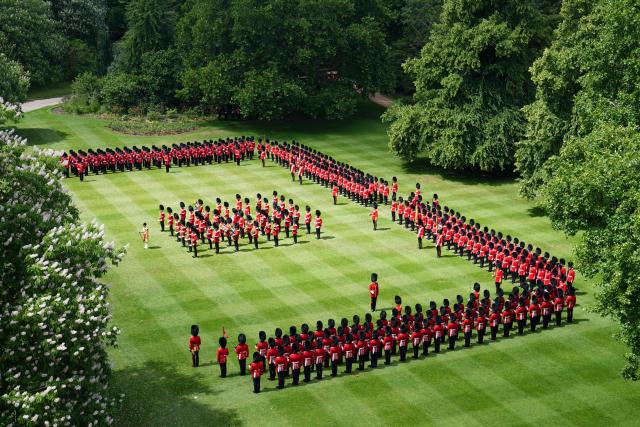Members of 1st Battalion Grenadier Guards attend a ceremony to present them with their new colours, at Buckingham Palace, in London, on June 9, 2026. (Photo by James Manning / POOL / AFP)