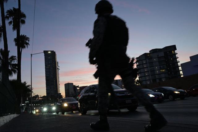 A member of Mexico's National Guard remains outside the hotel where Iran's national football team is staying in Tijuana, Mexico, on June 8, 2026, ahead of the FIFA 2026 World Cup football tournament. (Photo by Guillermo Arias / AFP)
