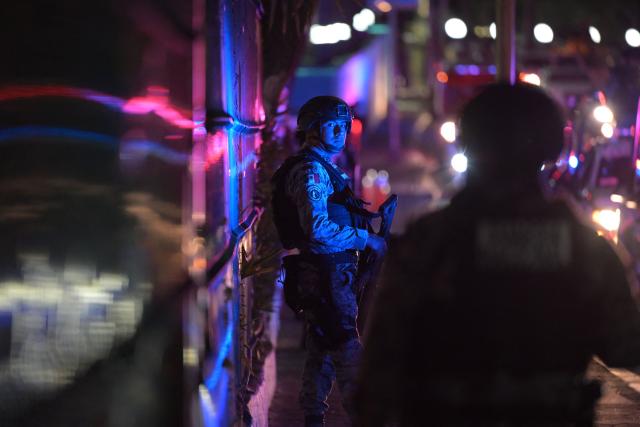A member of Mexico's National Guard remains outside the hotel where Iran's national football team is staying in Tijuana, Mexico, on June 8, 2026, ahead of the FIFA 2026 World Cup football tournament. (Photo by Guillermo Arias / AFP)