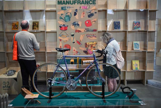 Visitors take part in the press preview at the Galerie Nationale du Design on the eve of its opening in the heart of the Cite du design in Saint-Etienne on June 9, 2026. This unique venue in France is dedicated to promoting French public design collections. (Photo by OLIVIER CHASSIGNOLE / AFP)
