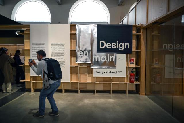 Visitors take part in the press preview at the Galerie Nationale du Design on the eve of its opening in the heart of the Cite du design in Saint-Etienne on June 9, 2026. This unique venue in France is dedicated to promoting French public design collections. (Photo by OLIVIER CHASSIGNOLE / AFP)
