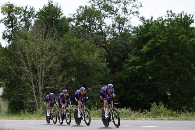 Team Picnic PostNL's team riders cycle during the 3rd stage of the Tour Auvergne-Rhone-Alpes cycling race (formerly known as the Criterium du Dauphine), 28,4km team time trial departing and arriving in Perreux near the Massif Central, on June 9, 2026. (Photo by Anne-Christine POUJOULAT / AFP)