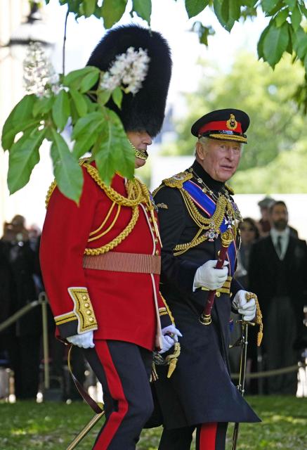 Britain's King Charles III attends a ceremony to present the new colours to the 1st Battalion Grenadier Guards, at Buckingham Palace, in London, on June 09, 2026. (Photo by Jordan Pettitt / POOL / AFP)