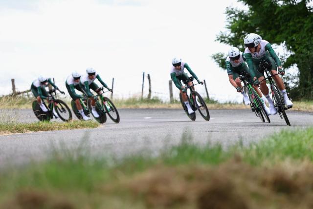 Caja Rural-Seguros RGA's team riders cycle during the 3rd stage of the Tour Auvergne-Rhone-Alpes cycling race (formerly known as the Criterium du Dauphine), 28,4km team time trial departing and arriving in Perreux central France, on June 9, 2026. (Photo by Anne-Christine POUJOULAT / AFP)