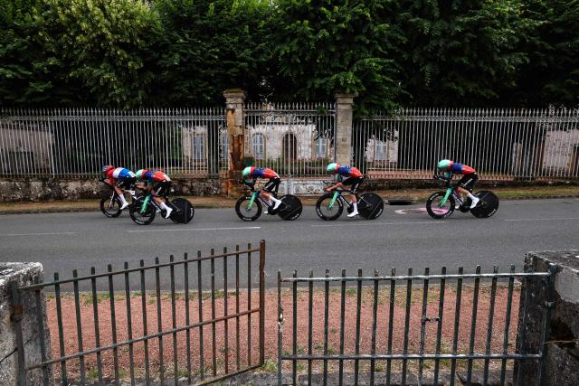 Decathlon CMA CGM Team's riders cycle during the 3rd stage of the Tour Auvergne-Rhone-Alpes cycling race (formerly known as the Criterium du Dauphine), 28,4km team time trial departing and arriving in Perreux central France, on June 9, 2026. (Photo by Anne-Christine POUJOULAT / AFP)