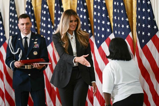 First Lady Melania Trump greets a student during the Presidential Artificial Intelligence Challenge National Champion Awards Ceremony in the East Room of the White House in Washington, DC on June 9, 2026. (Photo by Brendan SMIALOWSKI / AFP)